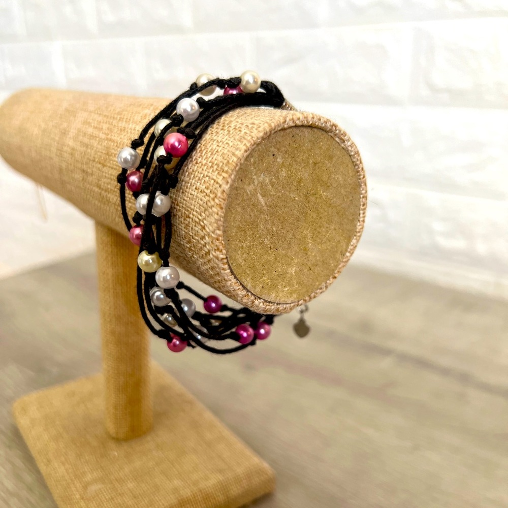 Trades of Hope Cambodian bracelet. Red and white Pearl stones.